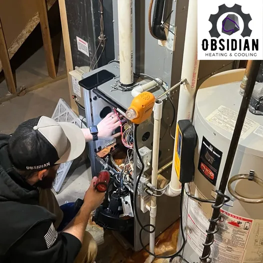 Obsidian technician diagnosing a residential gas furnace